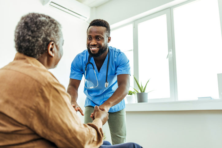 holding hands with elderly patient