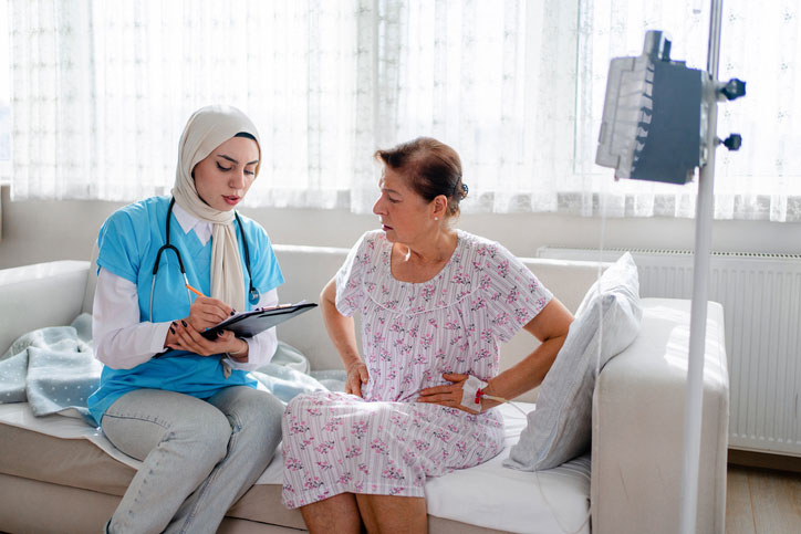 fnp talking with elderly woman in the hostpital