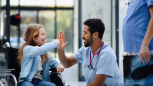 high five to young patient