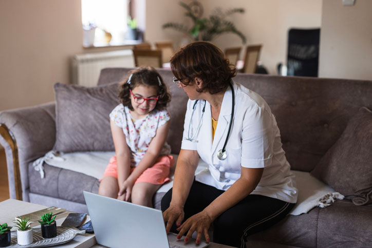 dnp talking with young girl while looking at a computer