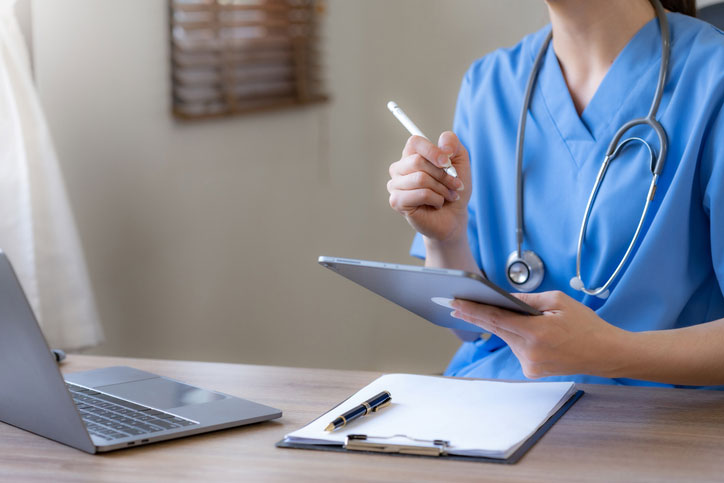 nurse filling out paperwork