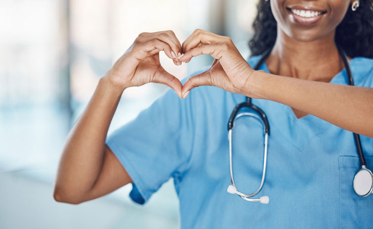 female dnp making heart with her hands