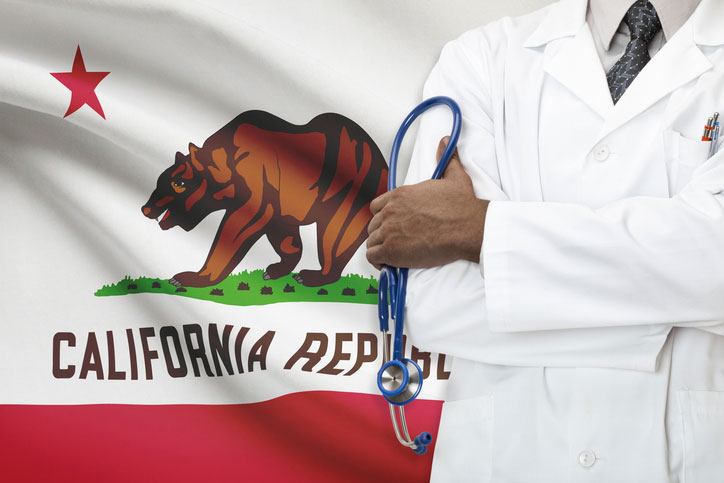 nurse practitioner in front of california flag